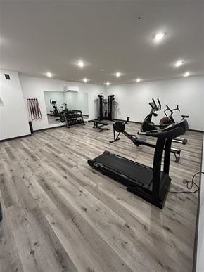 Saskatoon apartment for rent - A gym with a variety of equipment including treadmills, weights, and exercise machines.