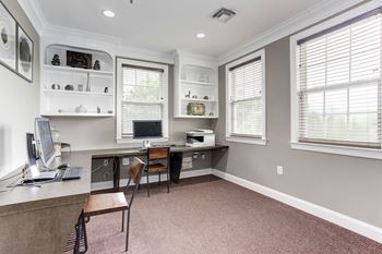 A home office with a desk and a computer