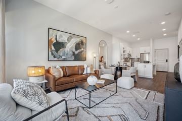 Reston apartment for rent - A modern living room with a large abstract painting on the wall.