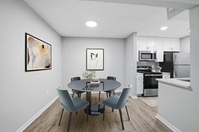 Cary apartment for rent - A modern dining room with a round table and grey chairs at Brampton Moors, Cary, NC, 27513