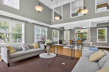 Woodbridge apartment for rent - A living room with a grey couch and a coffee table.
