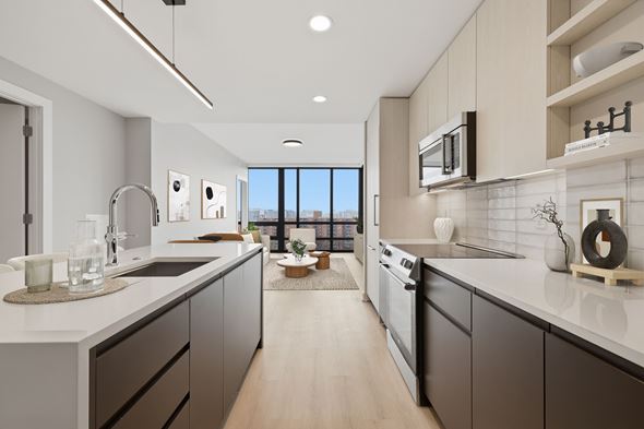 Washington apartment for rent - A modern kitchen with dark brown cabinets and a white countertop.