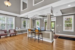 Woodbridge apartment for rent - A reception area with a desk and chairs.