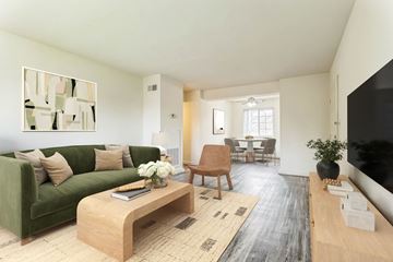 Silver Spring apartment for rent - A living room with a green couch and a wooden coffee table.