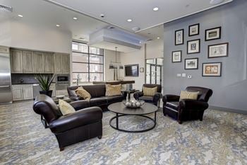 A living room with couches and chairs and a table