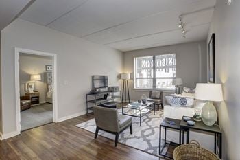 An open living room with a couch and a table