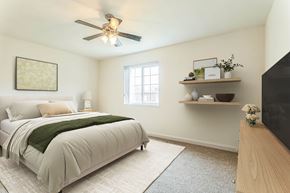 Silver Spring apartment for rent - A bedroom with a bed, a ceiling fan, and a window at The Fields of Silver Spring, Silver Spring