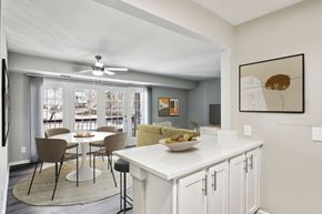 Triangle apartment for rent - A modern kitchen with a dining table and chairs at The Overlook at Quantico Apartments, Triangle, VA, 22172