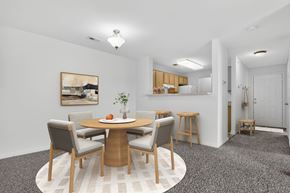 Woodbridge apartment for rent - A dining room with a round table and chairs.