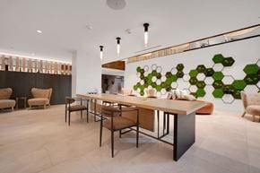 Reston apartment for rent - A modern dining room with a long table and chairs.