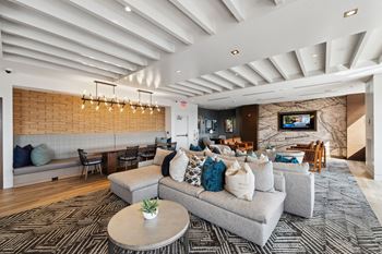 A living room with a couch and a table