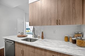 Alexandria apartment for rent - A kitchen with wooden cabinets and a marble countertopat Lincoln Old Town, Alexandria, VA 22314