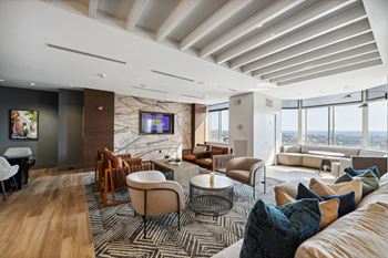 A living room filled with furniture and a large window