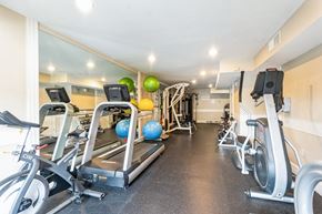Chevy Chase apartment for rent - A gym with treadmills, elliptical machines, and exercise balls at The Fields of Bethesda, Chevy Chase, MD