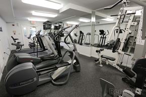 Rockville apartment for rent - A gym with treadmills, weights, and other exercise equipment at The Fields of Rockville, Rockville, 20850