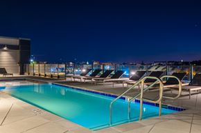 Washington apartment for rent - a swimming pool on the roof of a building at nightat The Chase at Bryant Street, District of Columbia