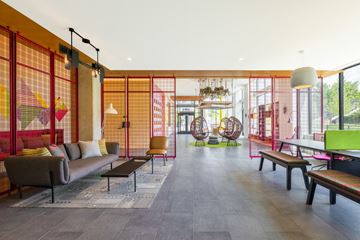 Washington apartment for rent - a living room with a couch and chairs and a ping pong table