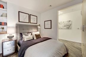 Washington apartment for rent - a bedroom with a bed and a closet at Reed Row, Washington, Washington DC