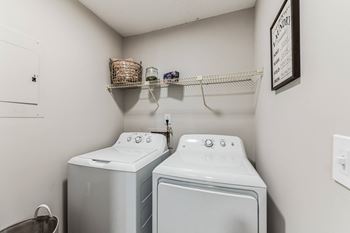 A laundry room with a washer and dryer