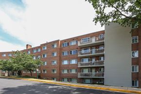 Arlington apartment for rent - A large brick building with balconies on the second floor.