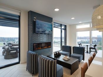A modern living room with a fireplace and a television