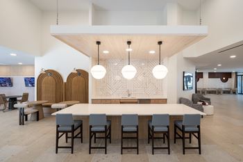 A conference room with a long table and chairs.