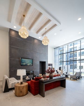 Chantilly apartment for rent - A modern living room with a fireplace and a large painting on the wall.