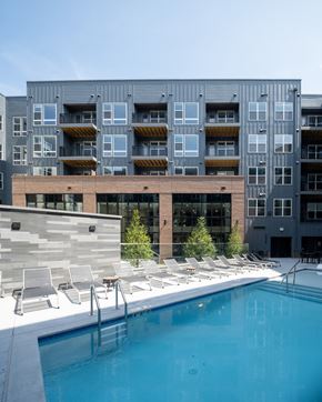 Chantilly apartment for rent - A modern building with a pool in front at The Sully Apartments, Chantilly, VA, 20151