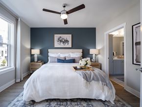Chantilly apartment for rent - A bedroom with a large bed and a ceiling fan at The Sully Apartments, Chantilly, VA