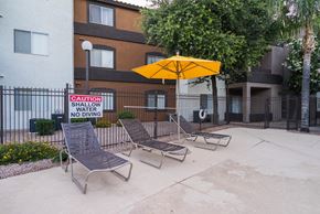 Phoenix apartment for rent - A pool area with a sign at Sterling Point Apartment Homes, Phoenix, Arizona