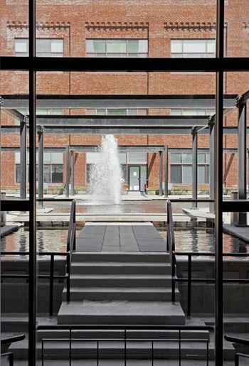 The view of the fountain through the windows of a building