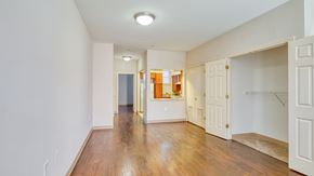 Frederick apartment for rent - a renovated living room with a hard wood floor and white walls at North Market South Carroll, Maryland, 21701