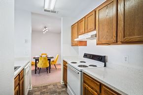Falls Church apartment for rent - Electric Range In Kitchen at The Fields at Merrifield, Virginia