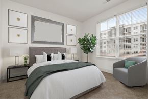Nottingham apartment for rent - a bedroom with a large bed and two windows