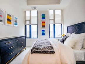 Tysons apartment for rent - a bedroom with a bed and a dresser at The Boro, Virginia, 22102