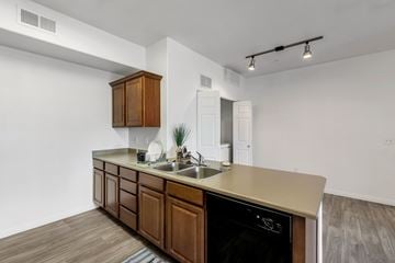 Midvale apartment for rent - A kitchen with a wooden counter and a black oven.