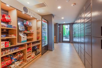 A store with a long hallway filled with shelves and a door