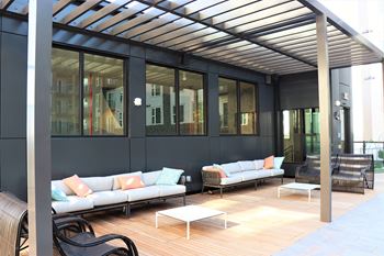 A patio with couches and tables
