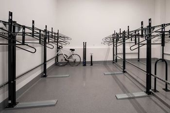 A bicycle is parked in a bike rack.