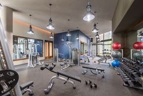 Mclean apartment for rent - Workout room with weights and other exercise equipment at Highgate at the Mile, McLean