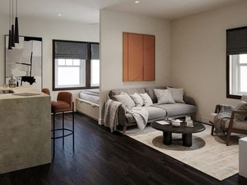 Salt Lake City apartment for rent - A modern living room with a grey sofa and a wooden coffee table.