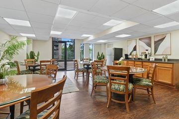 Fort Washington apartment for rent - A kitchen with wooden chairs and tables.