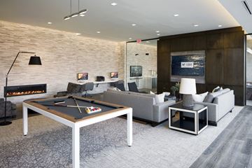 Baltimore apartment for rent - A billiard table is in the middle of a living room.
