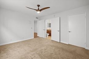 Hollywood multi-family for rent - A room with a ceiling fan and carpeted floor.