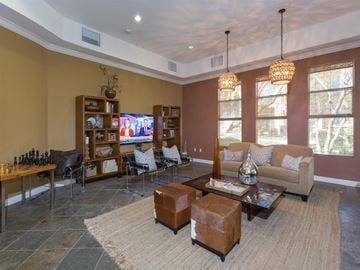 Bermuda Dunes multi-family for rent - a living room with a couch and a television