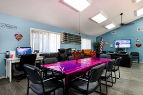 Rialto apartment for rent - A conference room with a purple table and chairs. at Heritage Park, Rialto, CA 92376