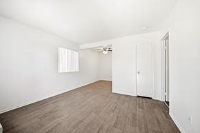 Rialto apartment for rent - A room with a wooden floor and white walls. at Heritage Park, Rialto, CA