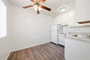Diamond Bar apartment for rent - A kitchen witA kitchen with white cabinets and a wooden floor white cabinets and a wooden floor. at Whispering Fountains Diamond Bar, Diamond Bar, CA