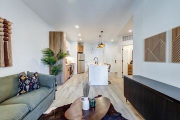 Aurora apartment for rent - A living room with a green couch and a coffee table.