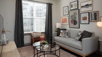 St. Louis apartment for rent - a living room with a couch and a coffee table    and a window